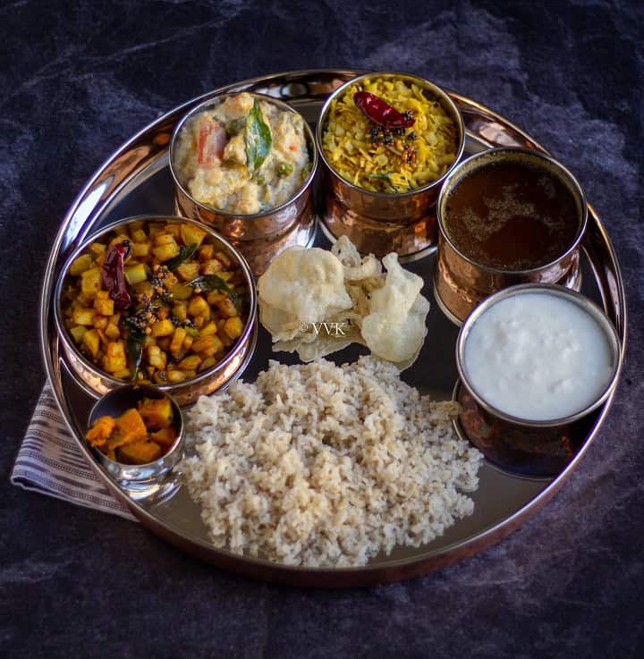 no onion no garlic lunch platter with potata, plantain, rasam, avial and rice