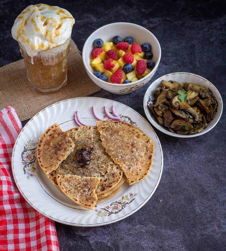 cheese paratha thali with raisin chutney and mushrooms