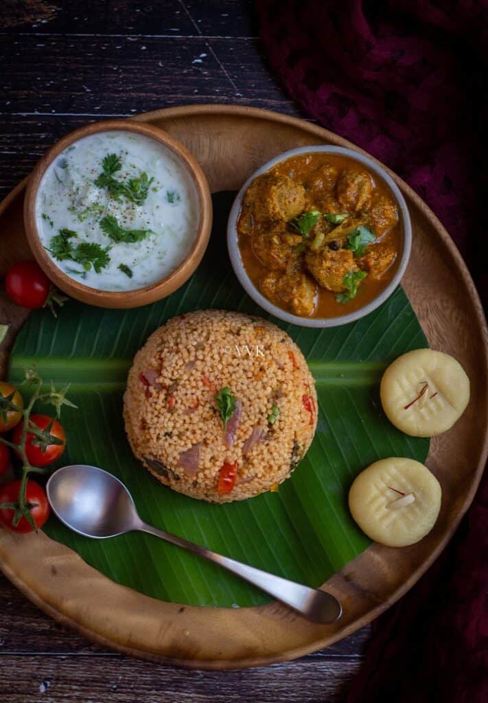 simple millet biryani served with raita, salna and peda