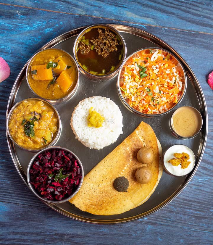 South indian festive special lunch menu for gowri habba where all the dishes are serve in big place and dishes are placed in small bowls