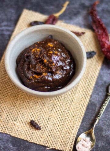 square image of raisin chutney in white ceramic bowl