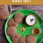 overhead shot of ragi idli served in green plate with chuntey and podi with text overlay for pinterest