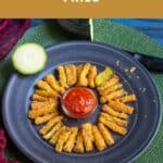 zucchini fries with marinara sauce with text overlay for pinterest