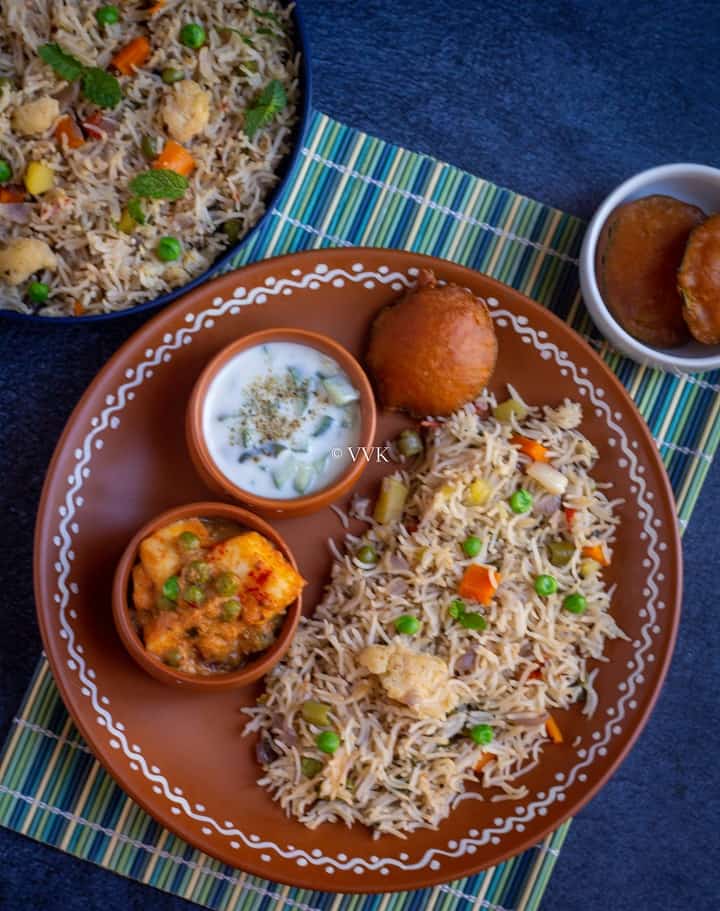 veg pulao platter with raita and matar paneer