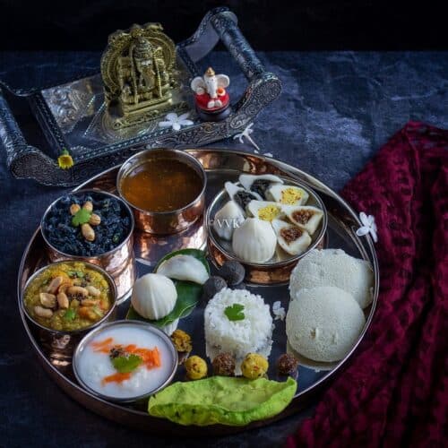 square image of ganesh chaturthi thali with assorted kozhukattai and dishes