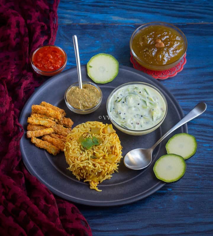 simple zucchini platter with zucchini fries, raita, rice, chutney and halwa