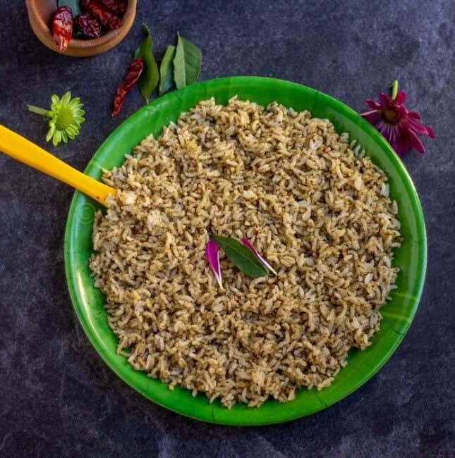 square image of sesame rice placed on a green leaf plate