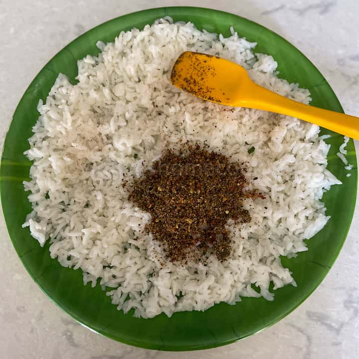 adding the ground powder to the rice