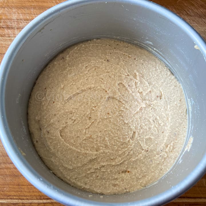 adding ricotta cheesecake mix in the cake pan