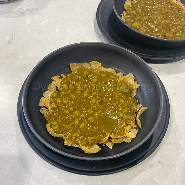 crushed poori topped with peas gravy