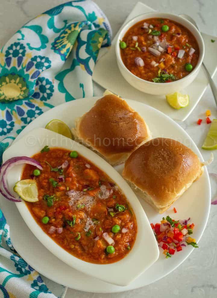 overhead shot of instant pot pav bhaji served in white bowl place on white plate