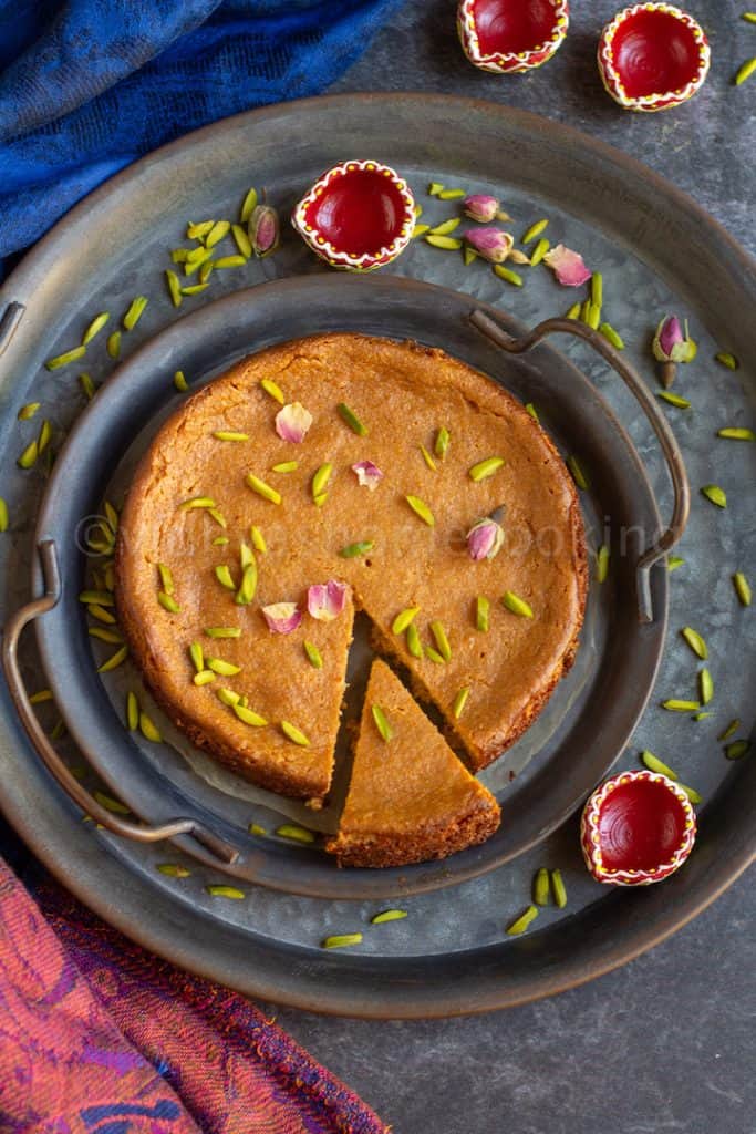 ricotta cheese chhena poda served on rustic trays with a slice cut