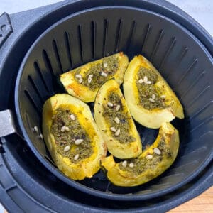 air frying acorn squash with pesto and pine nuts