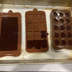 adding chocolate mixture to molds