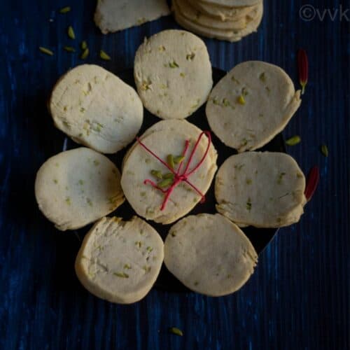 square image of eggless gulab jamun cookies placed on black plate