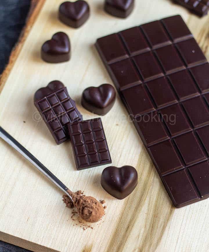 homemade dark chocolates placed on wooden board