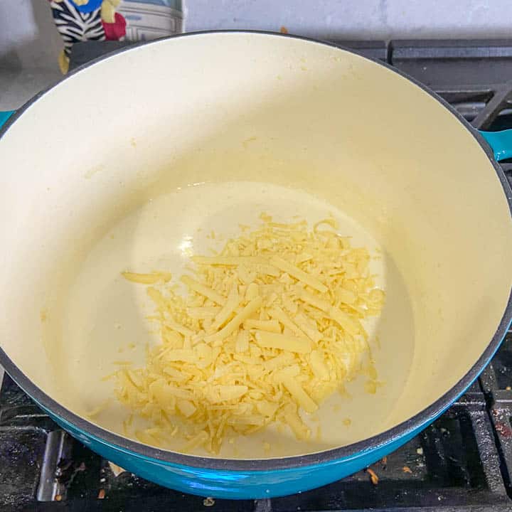 adding half the cheese measure