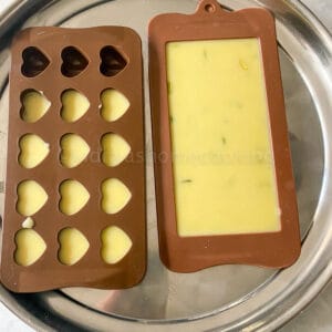 adding chocolate to the molds