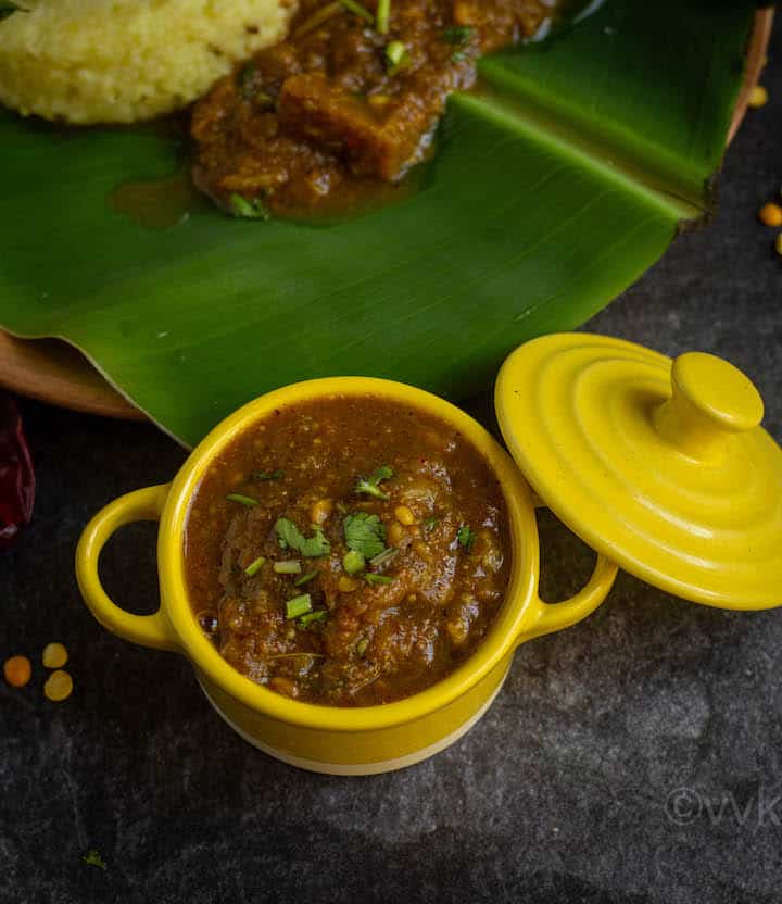 close up shot of brinjal gothsu served in yellow casserole