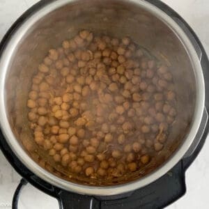 adding water to cook the chole
