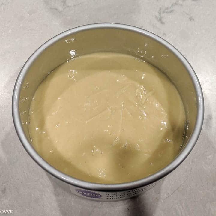 pouring the cake batter into the pan