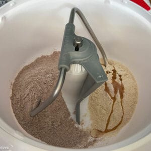 adding the flours to nutrimill artiste for kneading