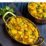 poori masala served in copper ware kadai with cilantro as a garnish with text overlay for pinterest