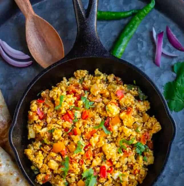 Paneer Bhurji served in a cute mini skillet on top of the tray with more goodies