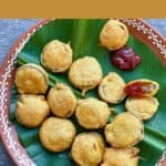 brinjal bajji on a terracotta plate with ketchup with text overlay for pinterest