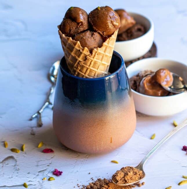 vegan icecream in waffle cones placed in ceramic mug