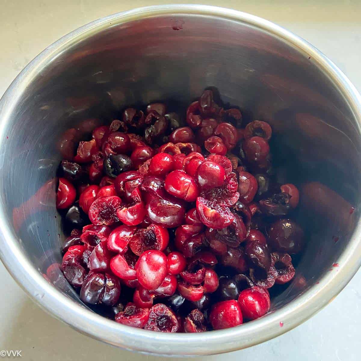 adding all the pitted cherries to the instant pot