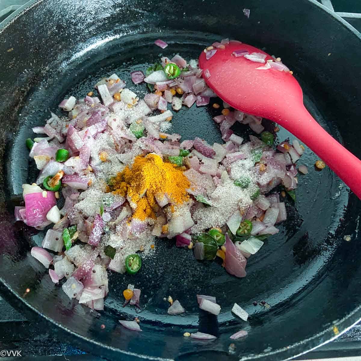 sauteed onions with salt and turmeric powder added