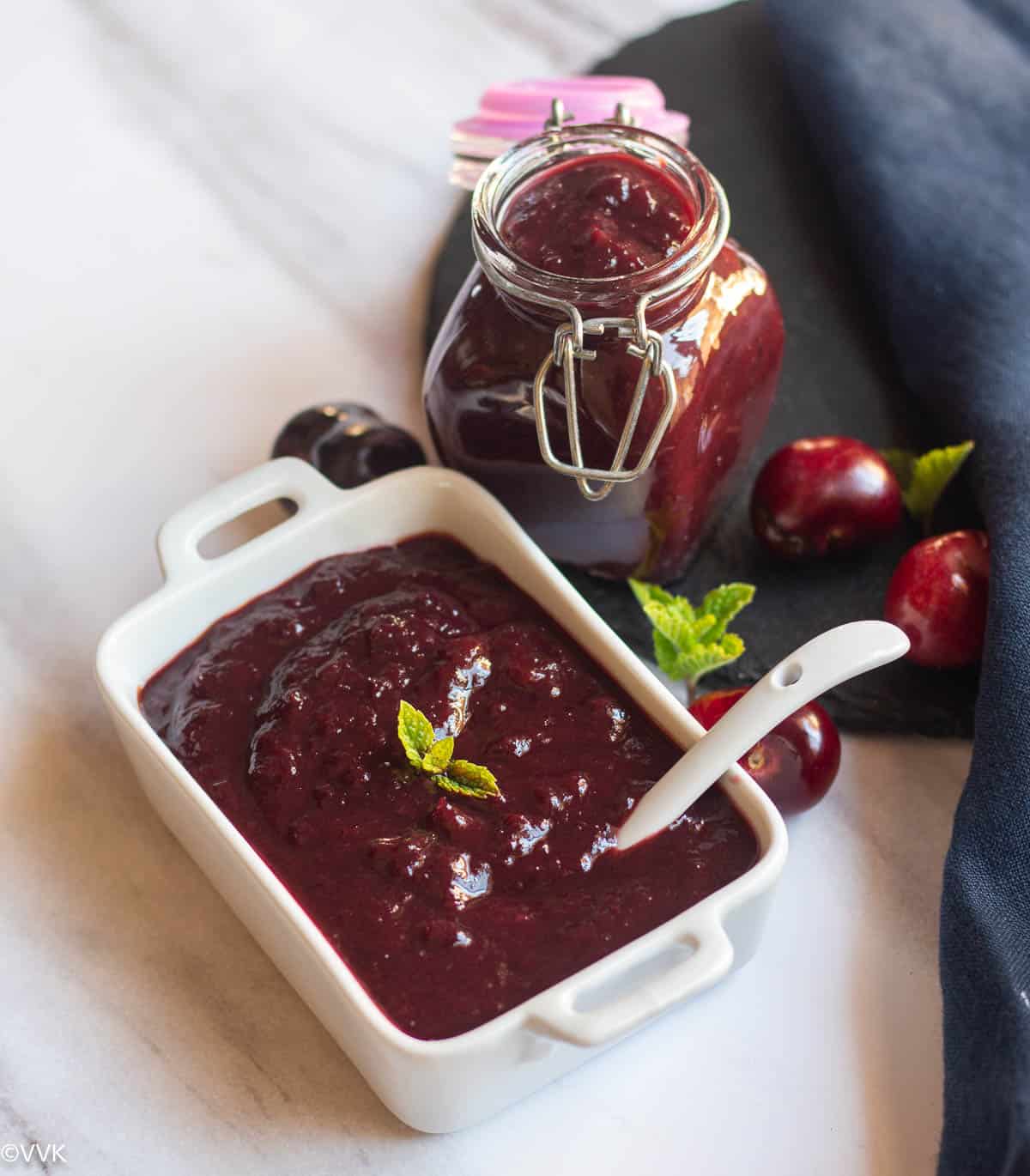 instant pot cherry relish in white serveware and in glass jar with cherries on the side