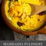 mambazha pulissery served in claypot with a spoon inside with text overlay for pinterest