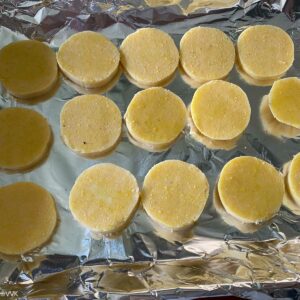 brushing the polenta with oil and baking