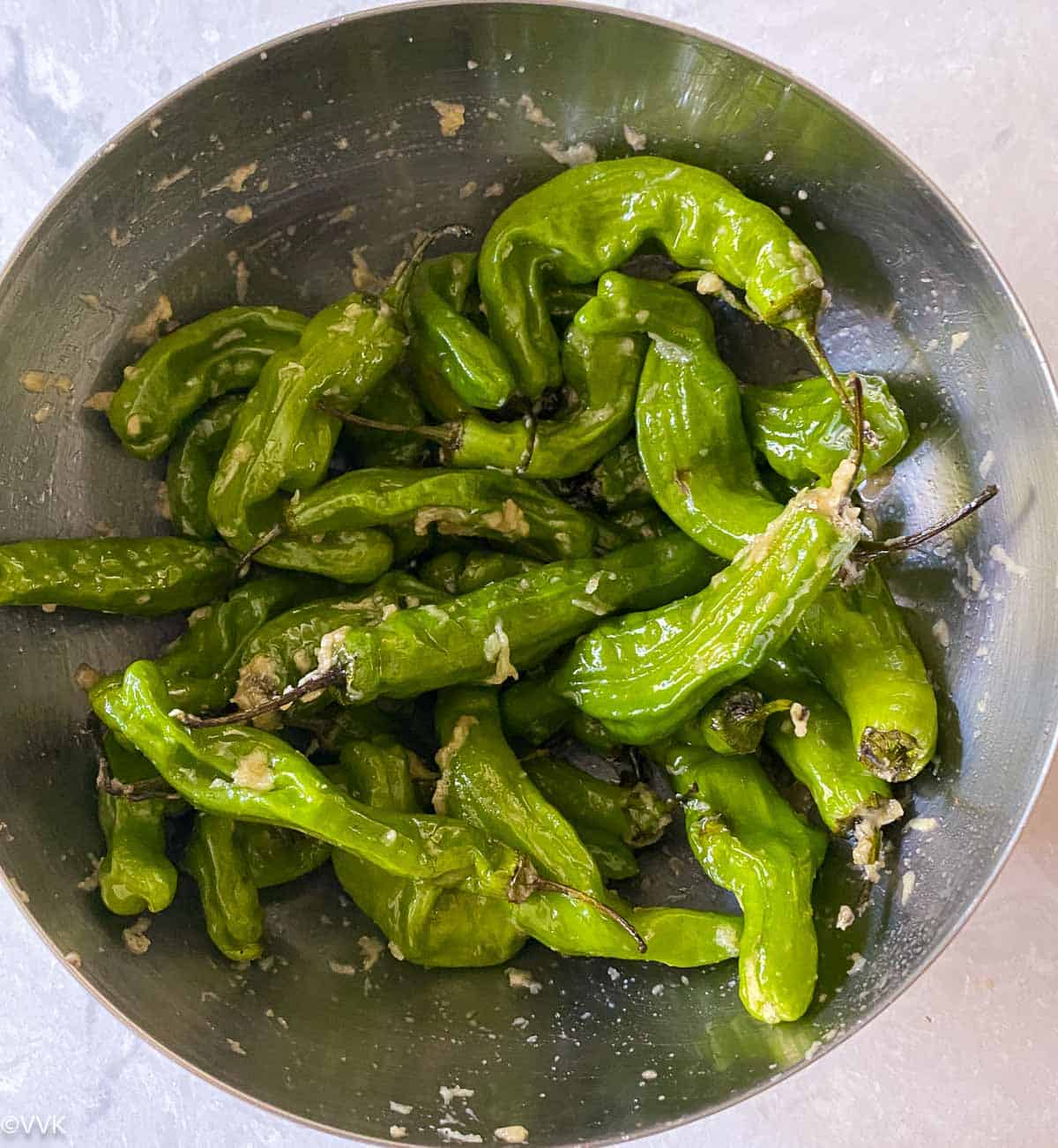 shishito peppers coated with oil, salt and garlic