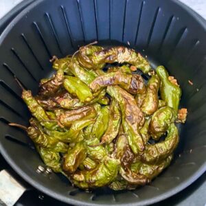 blistered and charred shishito peppers in the air fryer