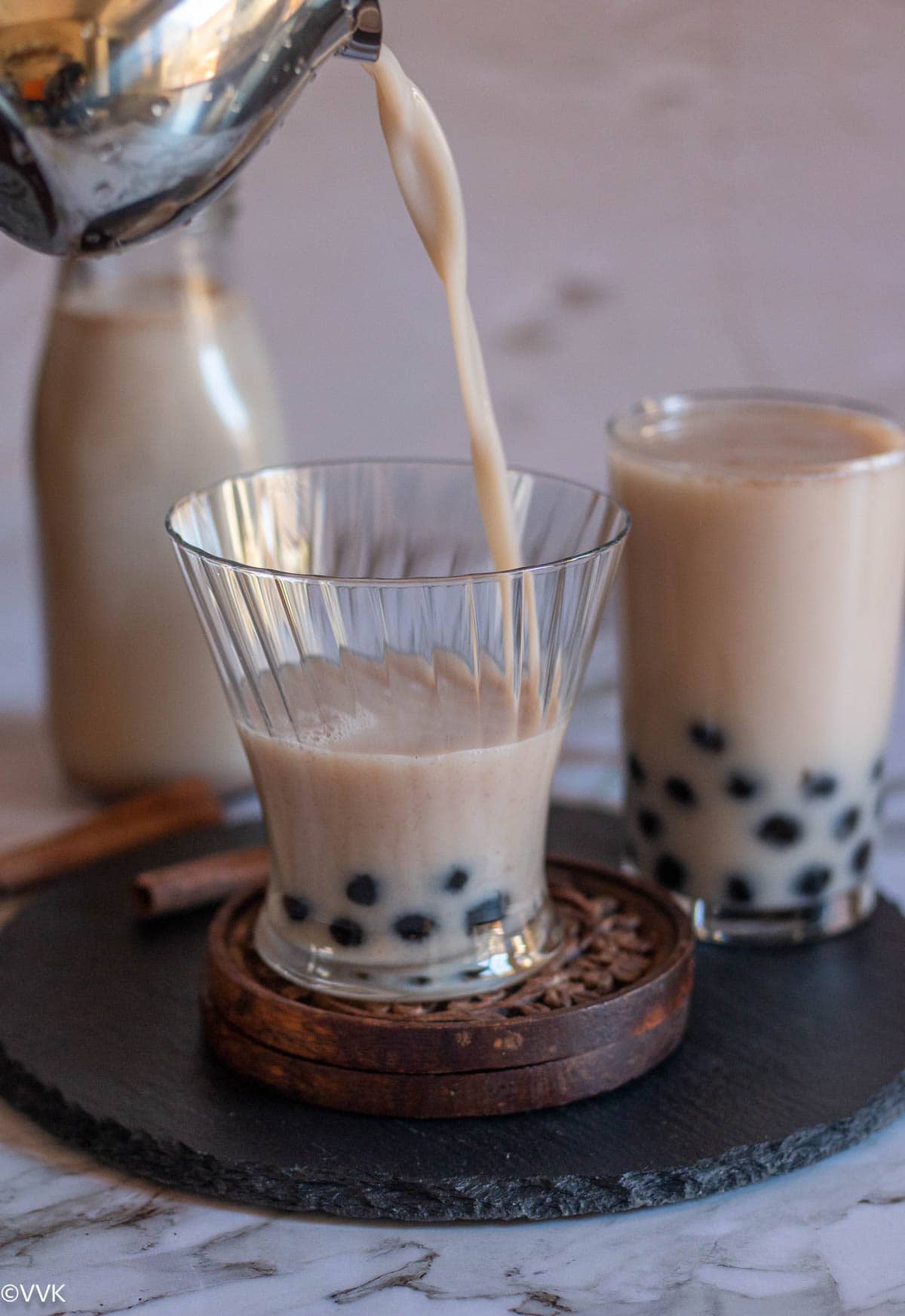 pouring shot of instant pressure cooker horchata into the glass ware