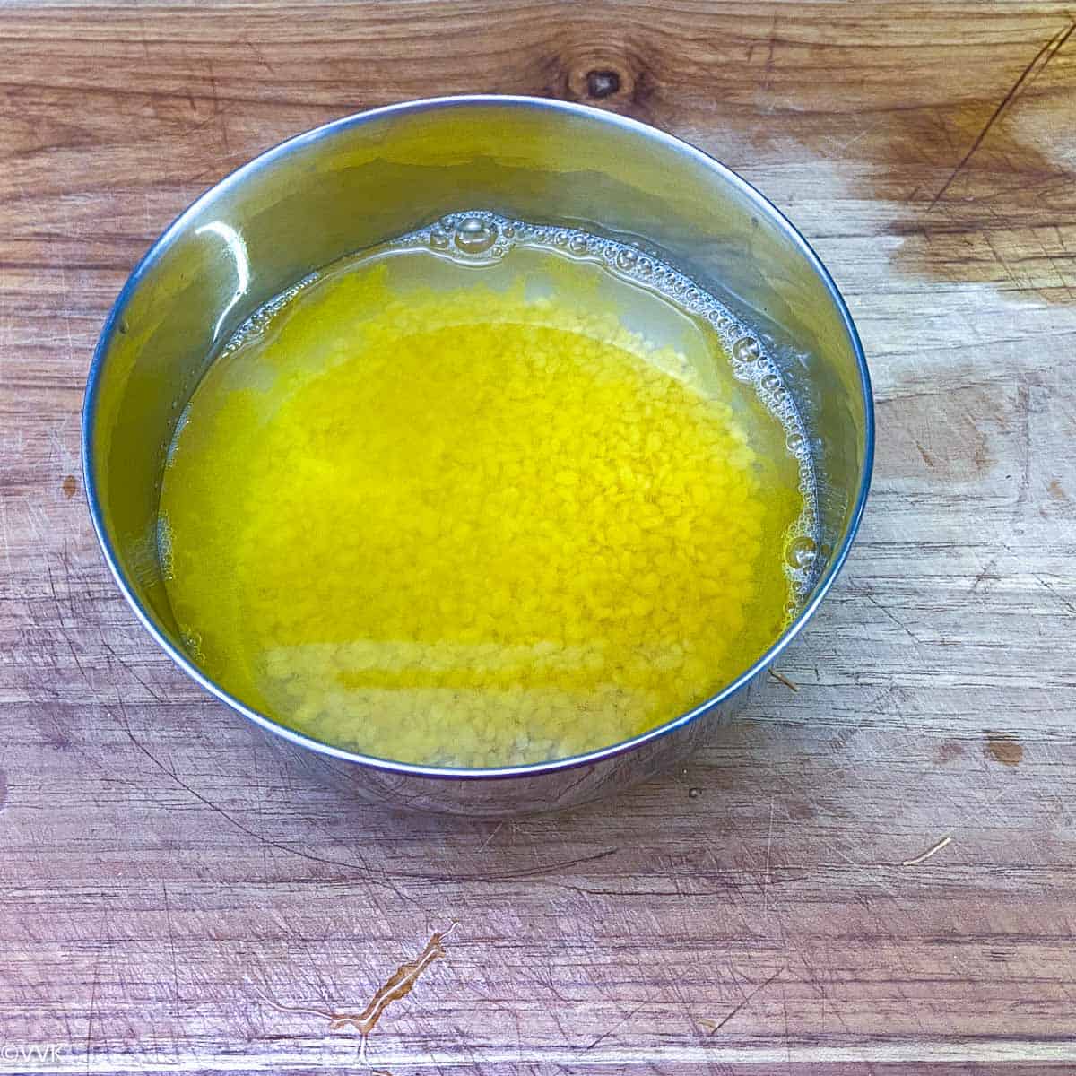 rinsed moong dal with water and turmeric