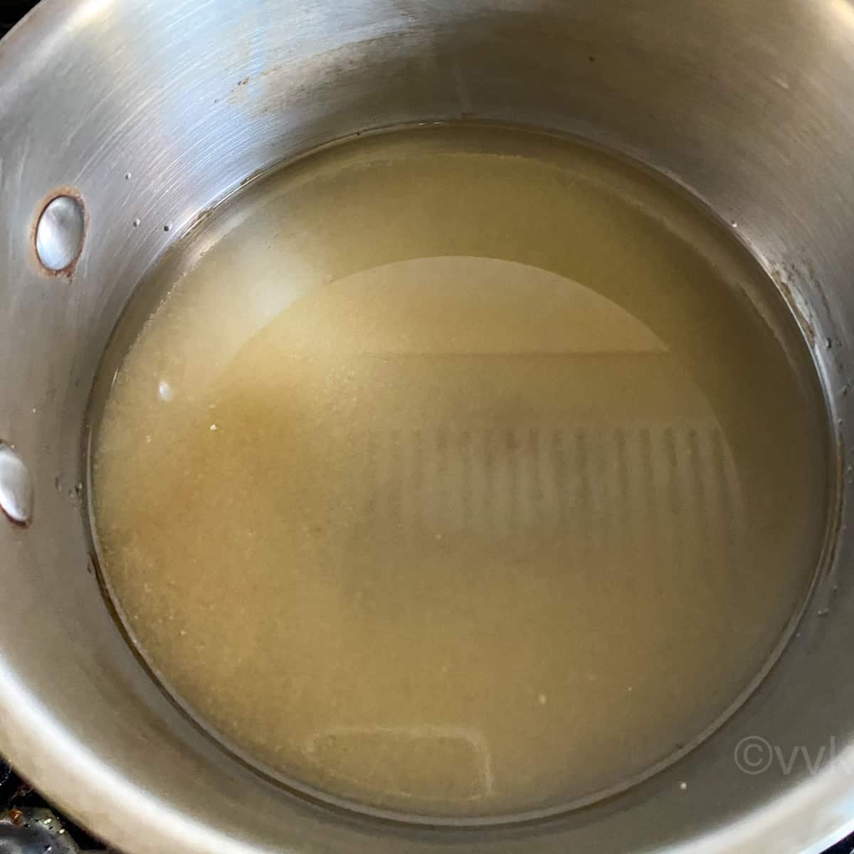simmering sugar and water in a saucepan