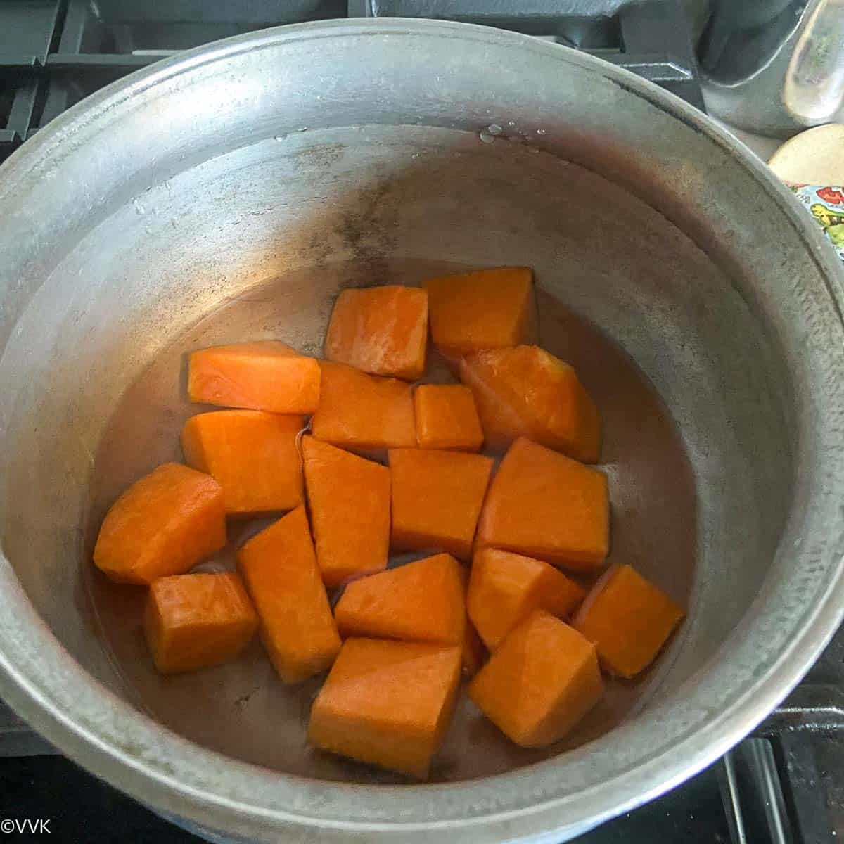 cooking pumpkin with water for the sambar