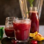 cherry lemon juice served in glasses with text overlay for pinterest