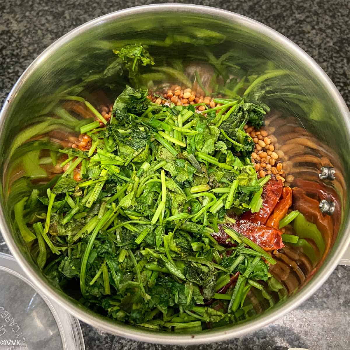 adding the cilantro chutney ingredients to the mixer jar