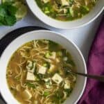 tofu noodle soup image with text overlay for pinterest