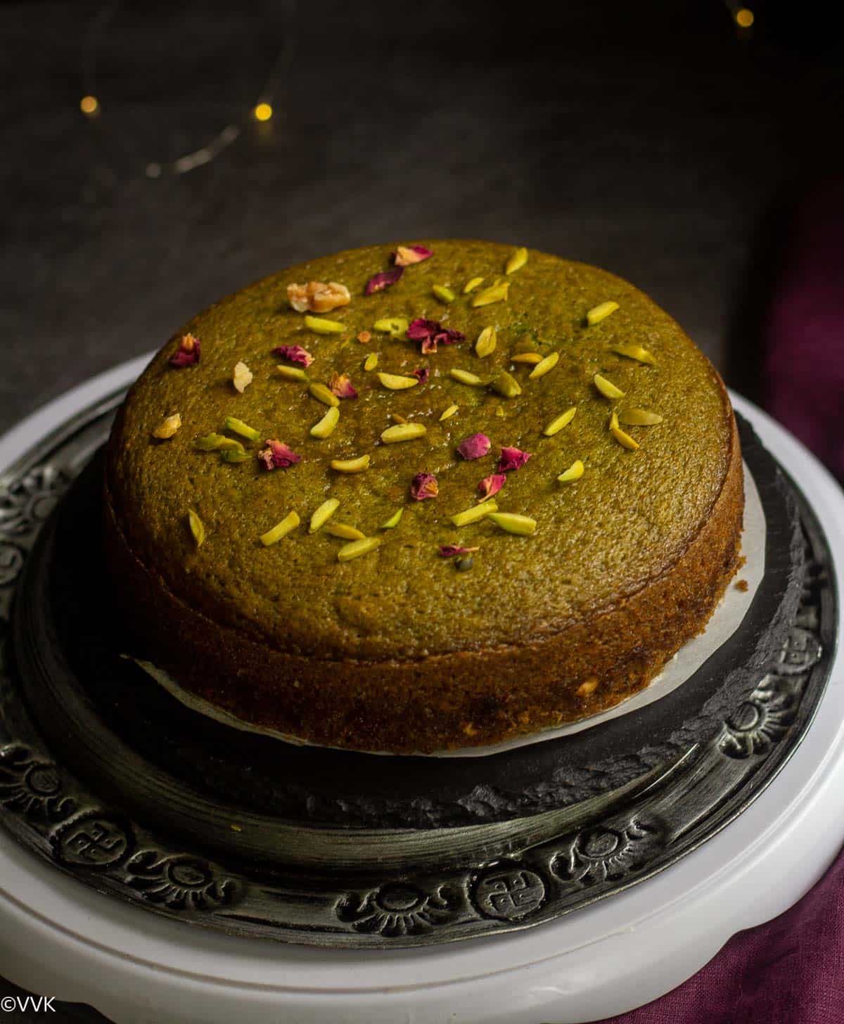 baked vegan paan cake with nuts and rosepetals on the top