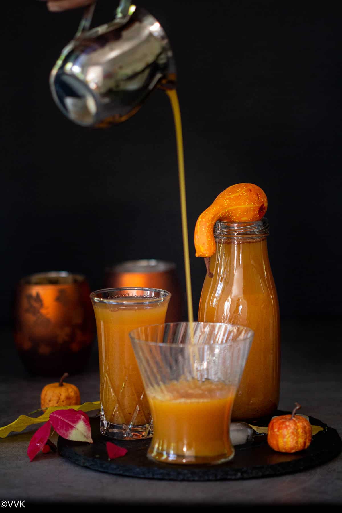 pouring shot of pumpkin juice