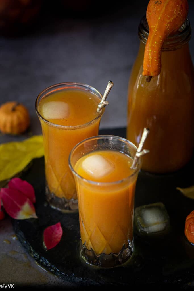 close up shot of pumpkin juice served with ice cubes