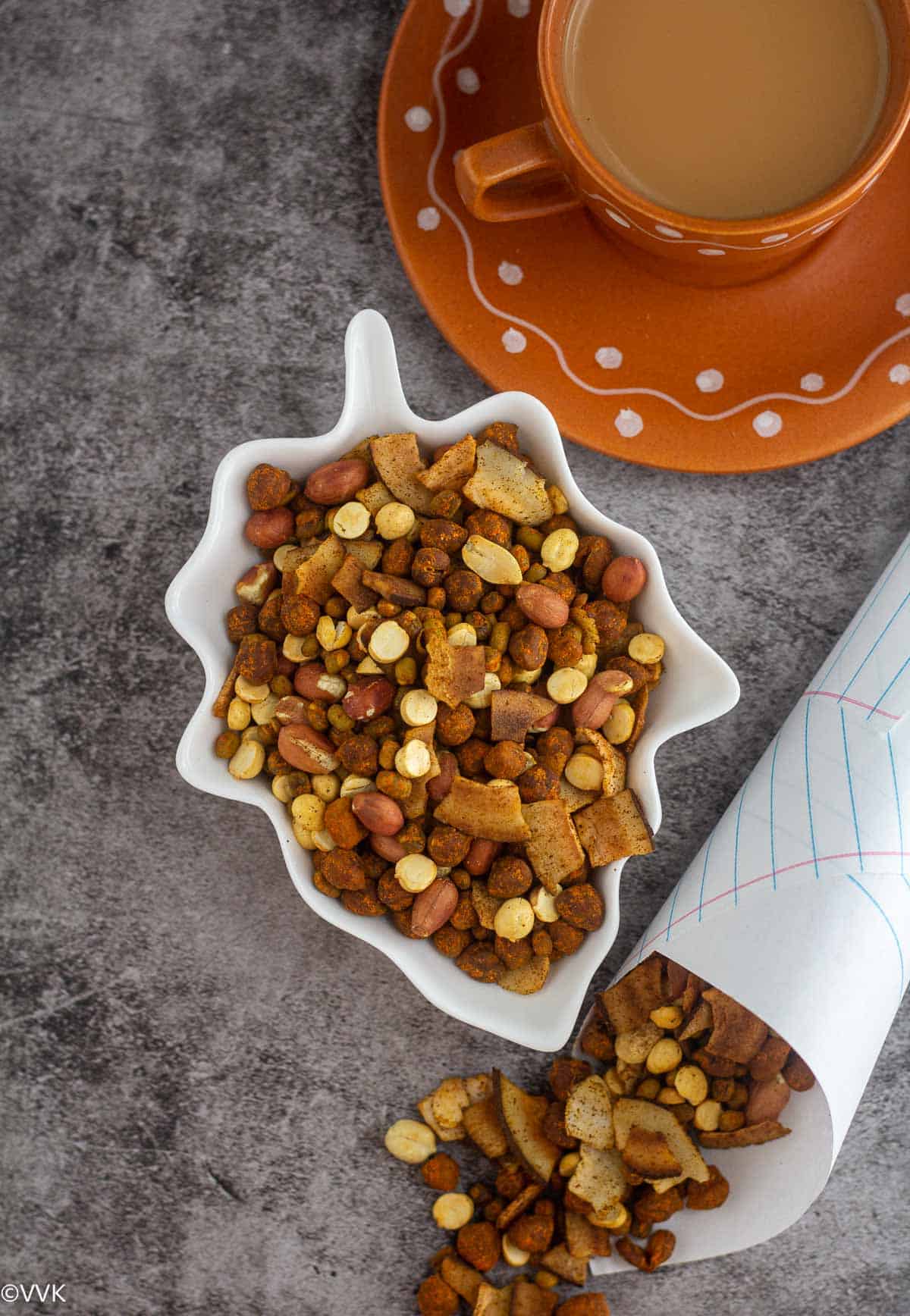 overhead shot of hurigaaly served in a leaf bowl with tea on the side