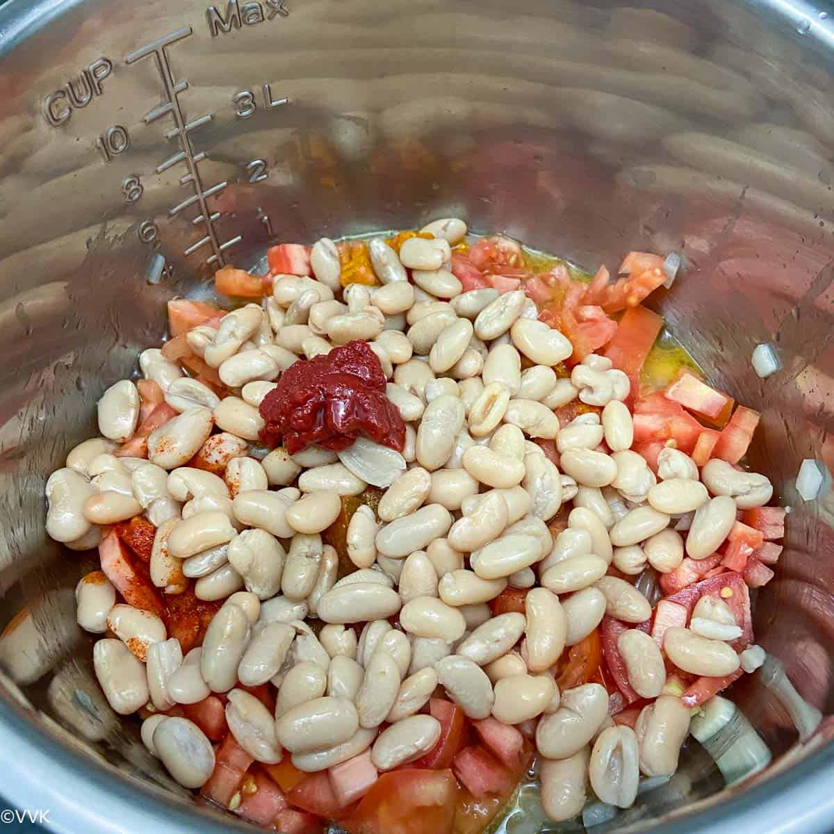 add beans tomato paste and broth