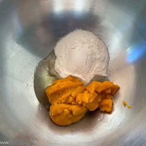 mixing pumpkin puree and sugar and oil